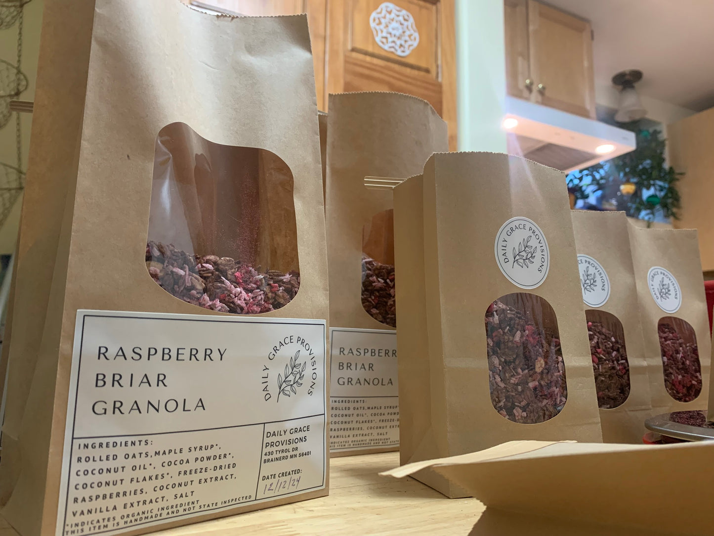 Packing up raspberry briar granola for daily grace provisions farmers market
