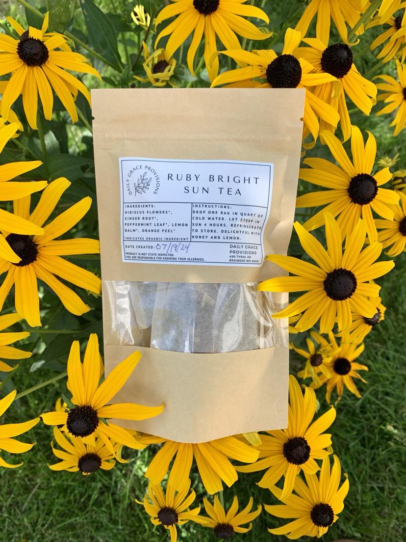 ruby bright sun tea amongst flowers