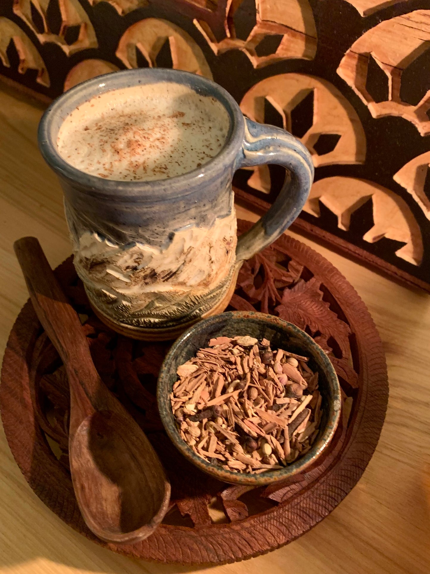 A cup of chai tea latte topped with nutmeg