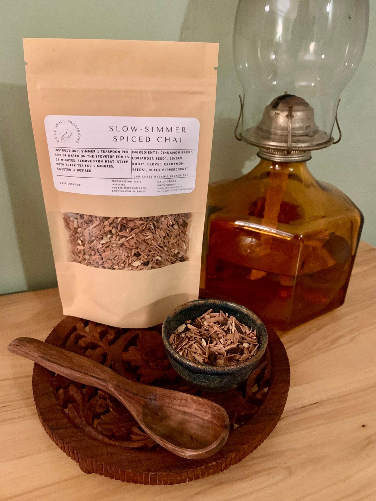 Packaging for slow simmer chai framed with loose herbs